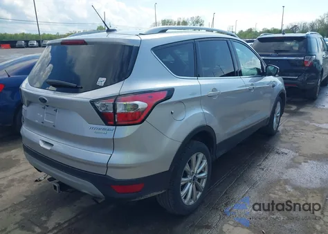 2017 Ford Escape Titanium z USA, uszkodzony, nr VIN 1FMCU0JD0HUD09406
